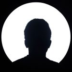 Home Artistic silhouette of an unknown person against a bright circular light background.